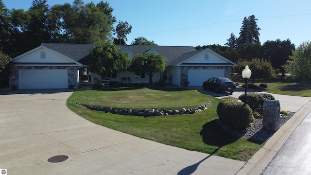 ranch-style house featuring a front lawn and a garage