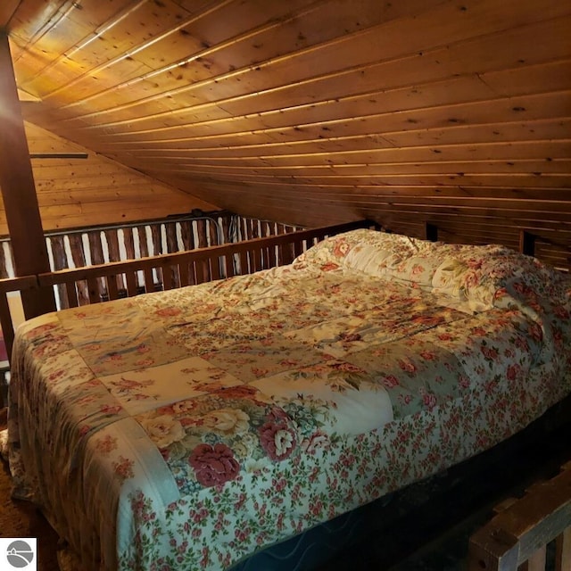 bedroom with lofted ceiling and wooden ceiling