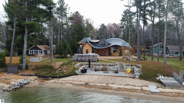 view of front facade with a water view