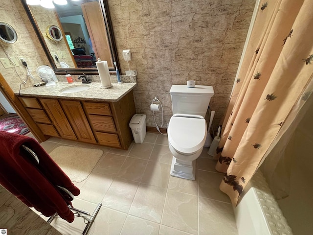 bathroom with vanity, toilet, and tile floors