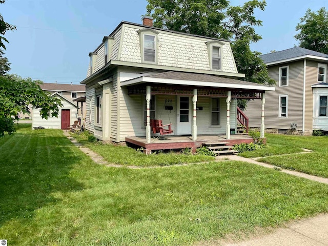 view of front of property featuring a porch and a front lawn