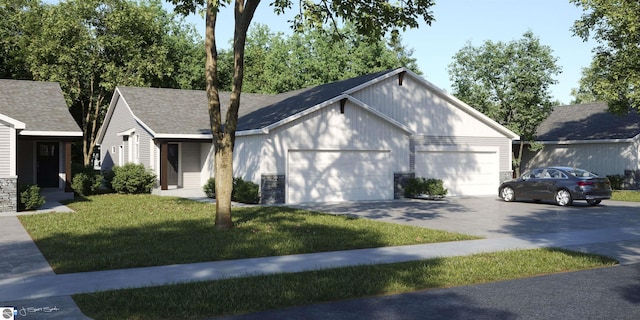 view of front of home featuring a front yard and a garage