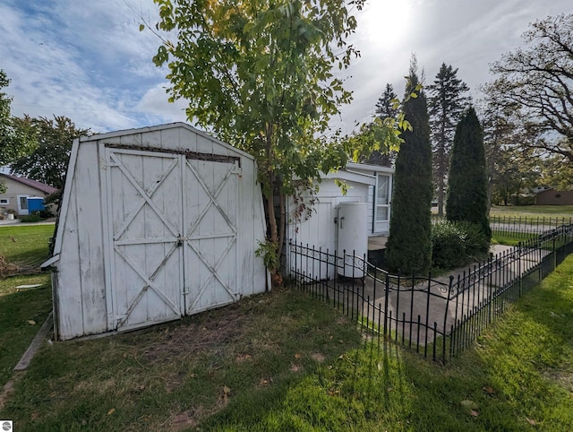 view of outdoor structure featuring a lawn