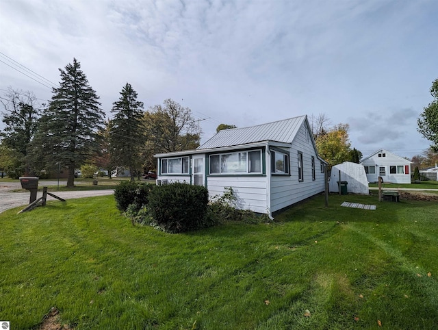 view of property exterior with a yard