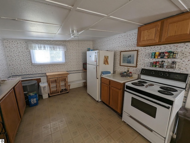 kitchen with white appliances and light tile floors