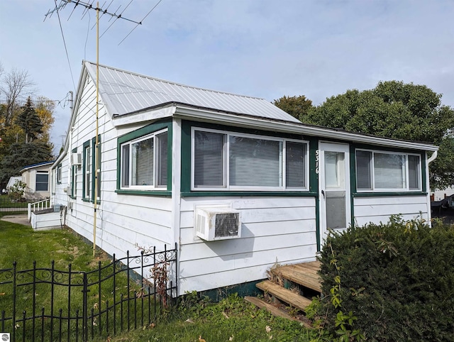 view of side of home featuring a yard