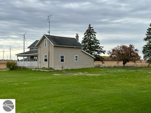 view of property exterior featuring a yard