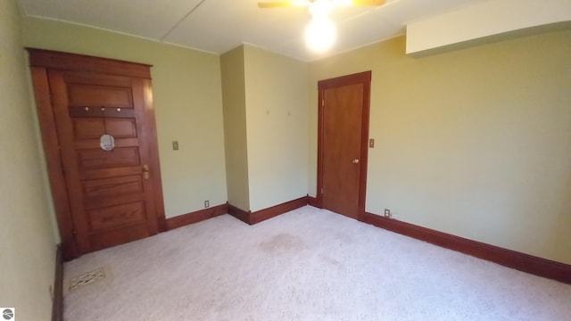 spare room with light colored carpet