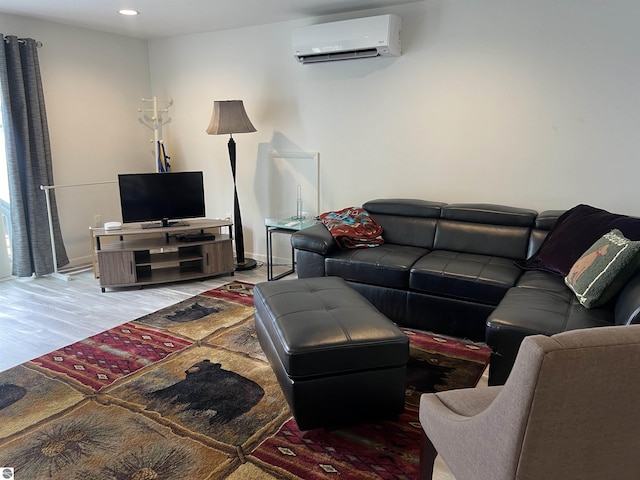 living room featuring hardwood / wood-style floors and a wall mounted AC