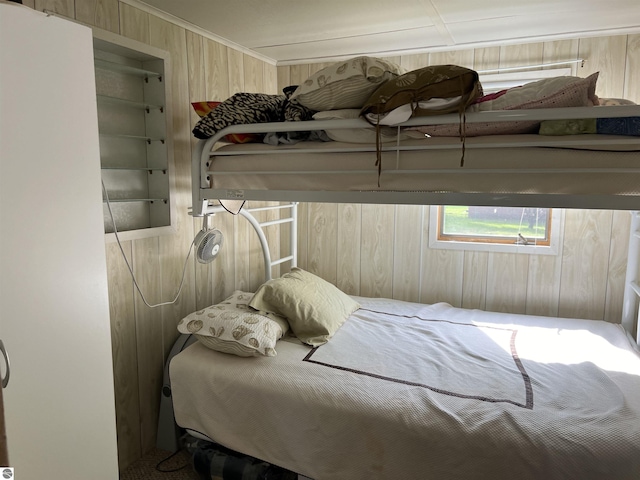 bedroom with wooden walls