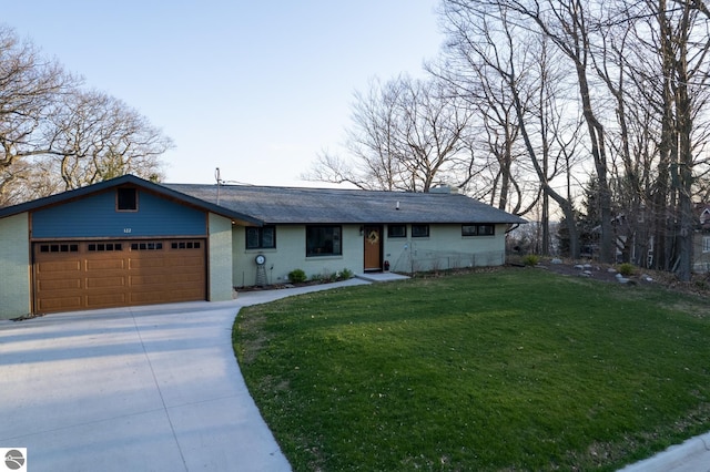 ranch-style home with a garage and a front yard