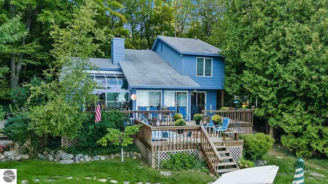 rear view of property with a deck