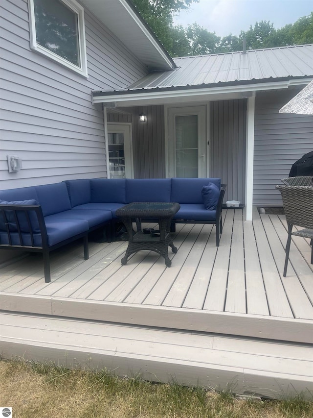 wooden deck featuring an outdoor hangout area