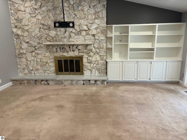 unfurnished living room with a fireplace and vaulted ceiling