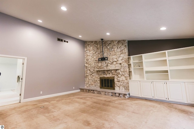 unfurnished living room featuring a fireplace and light carpet