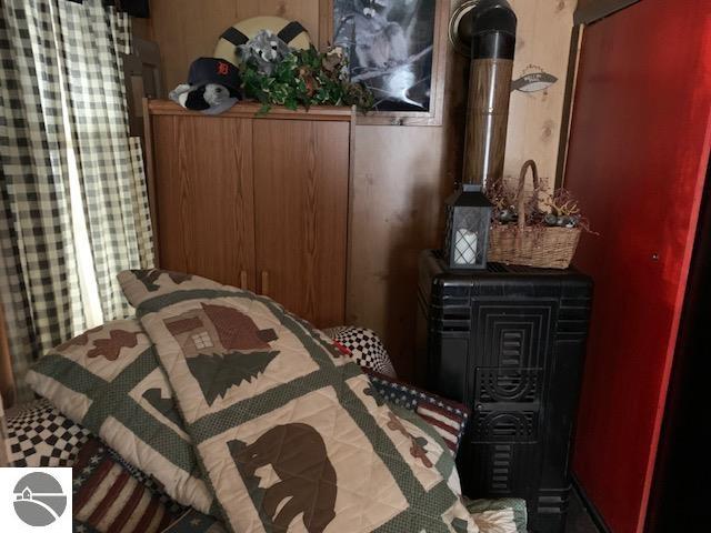 bedroom with a wood stove