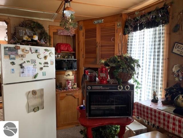 interior space featuring white fridge