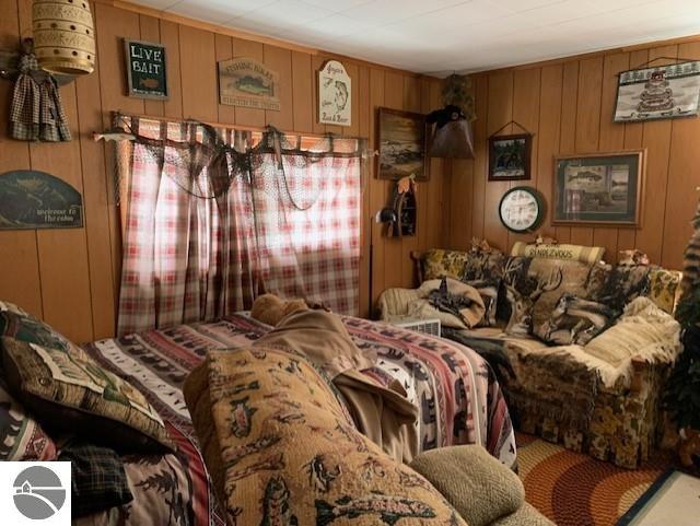 bedroom with wooden walls