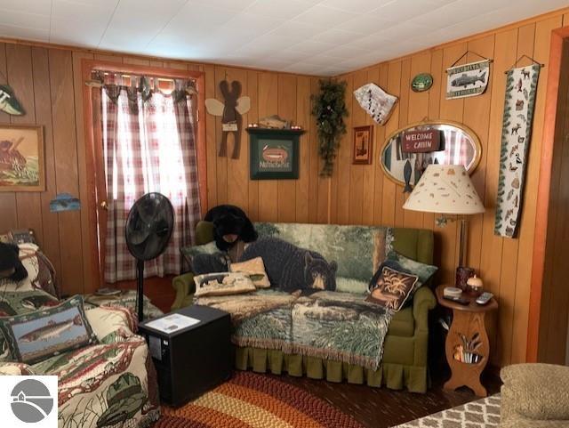 living room with wood walls