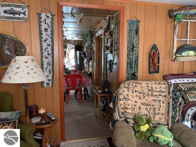 interior space with wooden walls and carpet