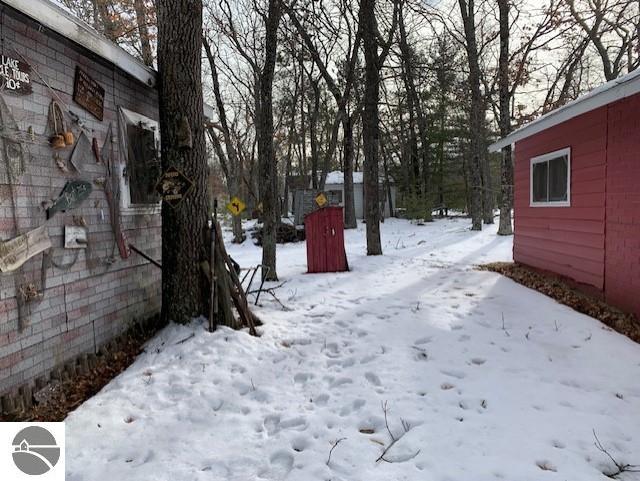 view of yard layered in snow