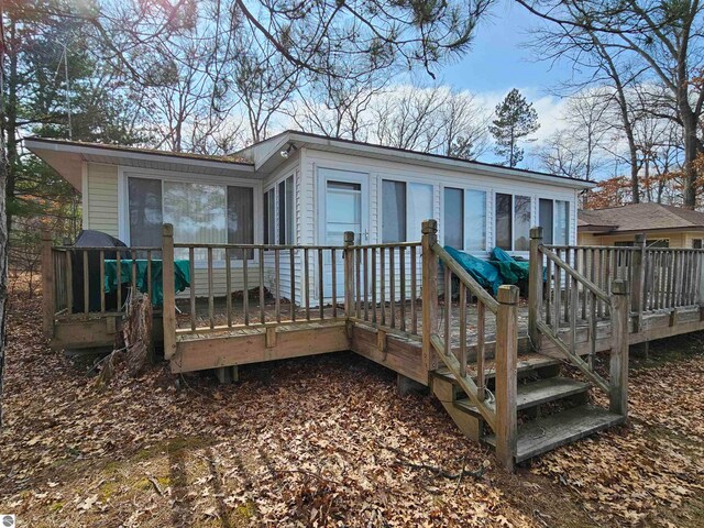 5934 Chippewa Trl, Hale, MI 48739 - back of property featuring a deck