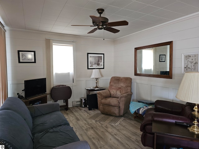 5934 Chippewa Trl, Hale, MI 48739 - living area with ornamental molding, wood finished floors, and a ceiling fan