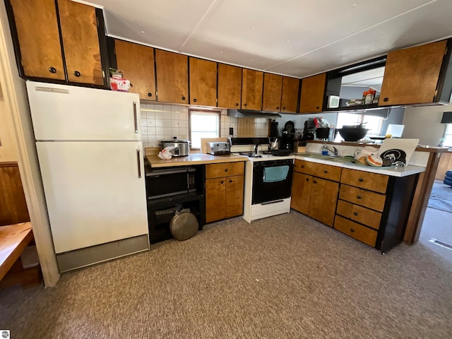 kitchen with backsplash and white appliances