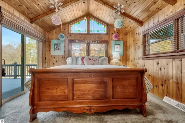 carpeted bedroom with wooden walls, access to outside, lofted ceiling with beams, and wood ceiling