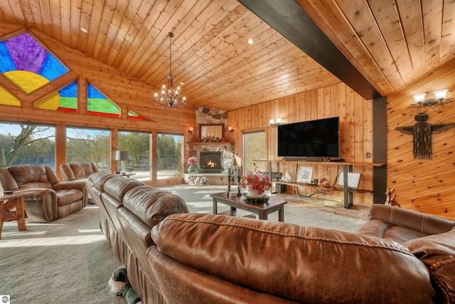 living room featuring wood walls, a fireplace, beamed ceiling, wooden ceiling, and light carpet