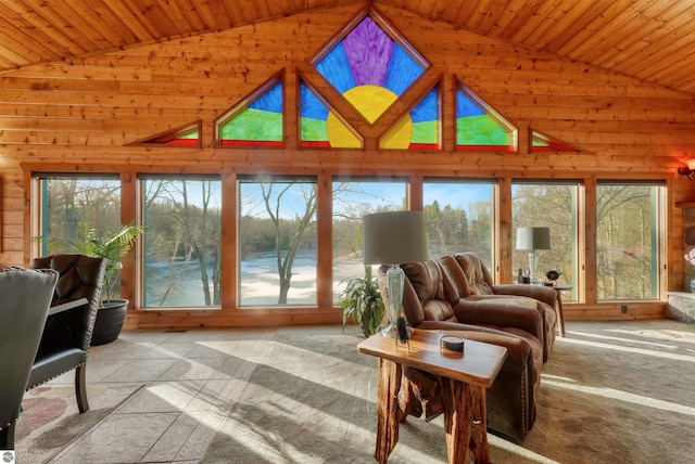 sunroom featuring lofted ceiling and wooden ceiling