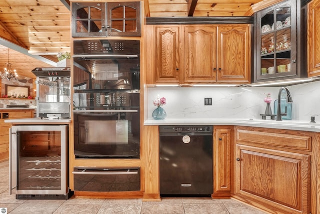 kitchen with wooden ceiling, sink, black appliances, light tile patterned flooring, and beverage cooler