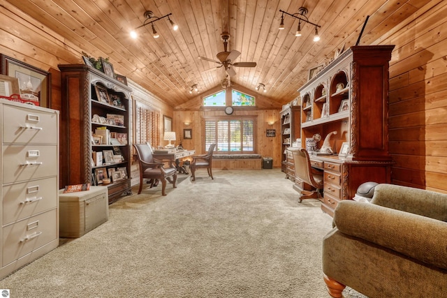 sitting room featuring vaulted ceiling, ceiling fan, decorative columns, wood ceiling, and light colored carpet