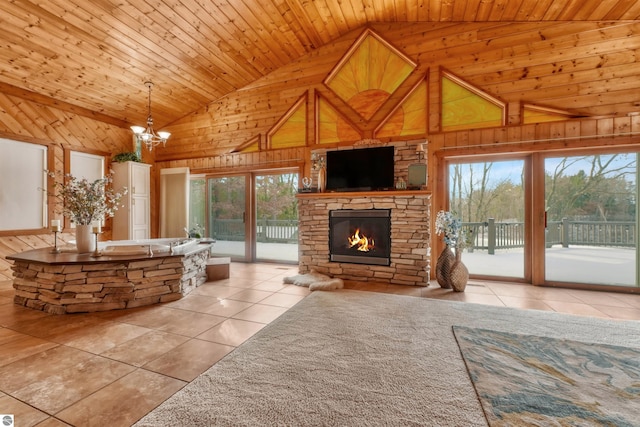 unfurnished living room with a wealth of natural light, high vaulted ceiling, and wood ceiling