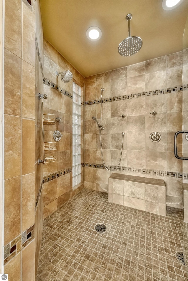 bathroom with tiled shower