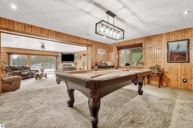 game room with pool table, wood walls, and carpet floors