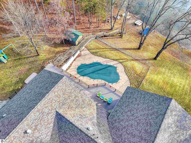 view of home's community featuring a swimming pool and a patio