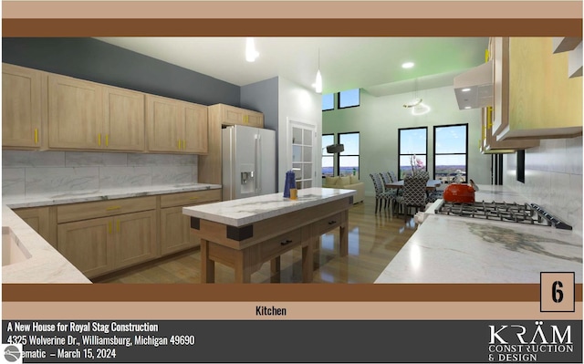 kitchen with tasteful backsplash, light brown cabinetry, cooktop, light stone counters, and stainless steel refrigerator with ice dispenser