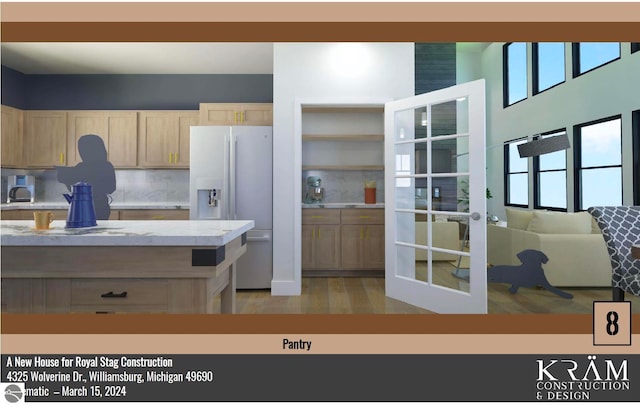 kitchen featuring fridge with ice dispenser, decorative backsplash, light brown cabinets, and light countertops