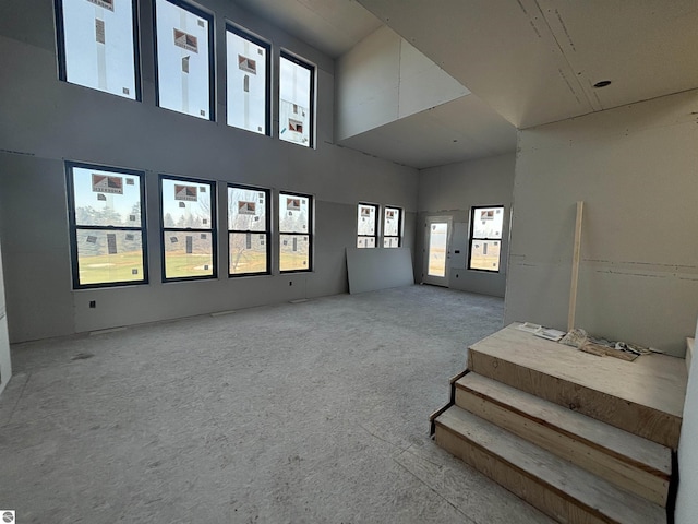 living room featuring a high ceiling