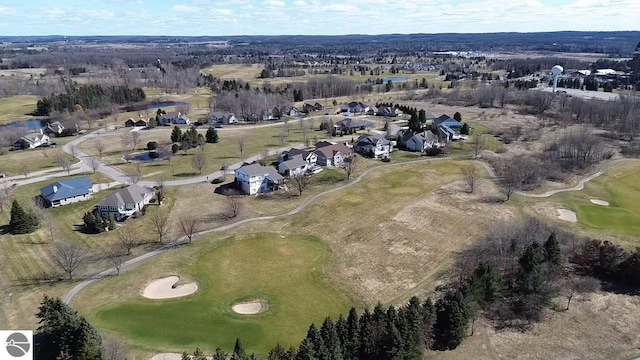 aerial view with golf course view and a residential view