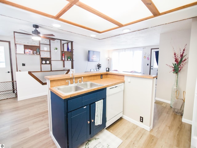 kitchen with ceiling fan, sink, dishwasher, blue cabinetry, and light hardwood / wood-style floors