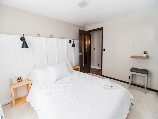 bedroom featuring light carpet