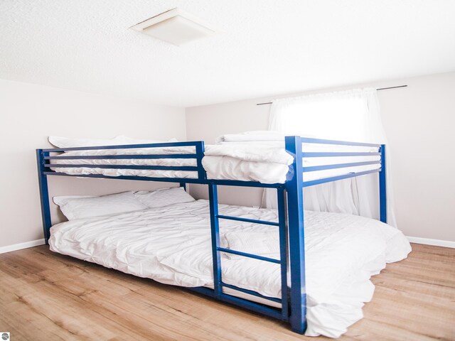 bedroom with light hardwood / wood-style floors