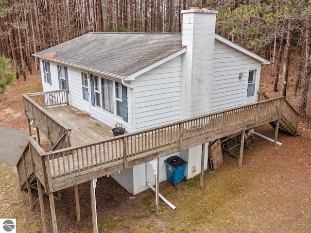 rear view of house featuring a deck