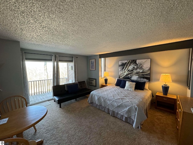 carpeted bedroom featuring a wall unit AC, access to outside, and a textured ceiling