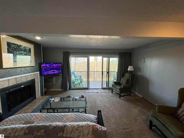 living room with a fireplace, a textured ceiling, and light colored carpet