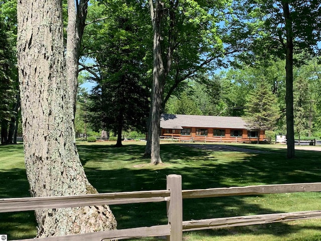 view of home's community featuring a lawn