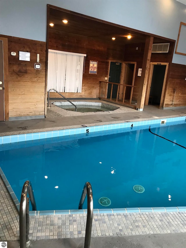 view of pool featuring a hot tub