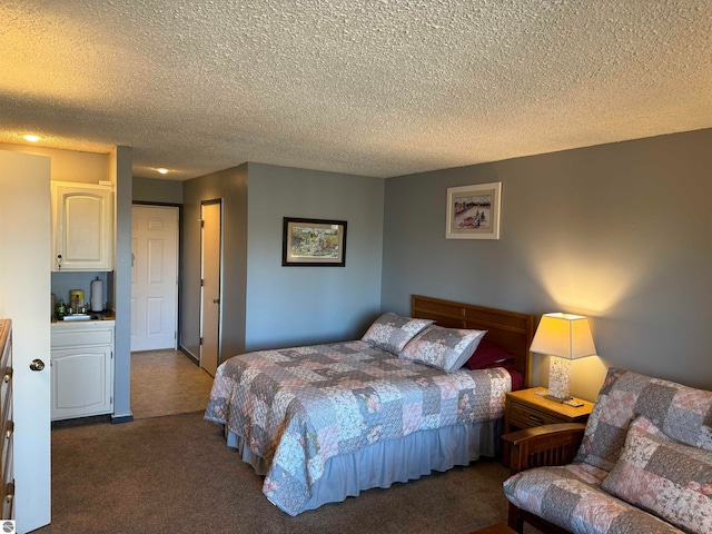 carpeted bedroom with a textured ceiling